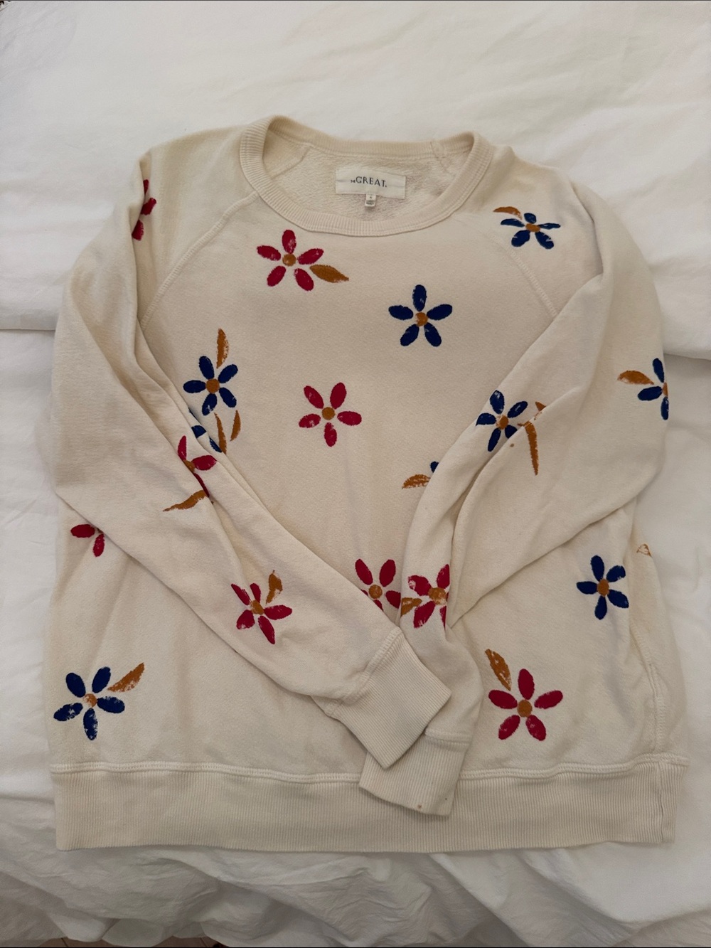 THE GREAT. Cream Crewneck Sweater with Red, Blue & Gold Floral Embroidery